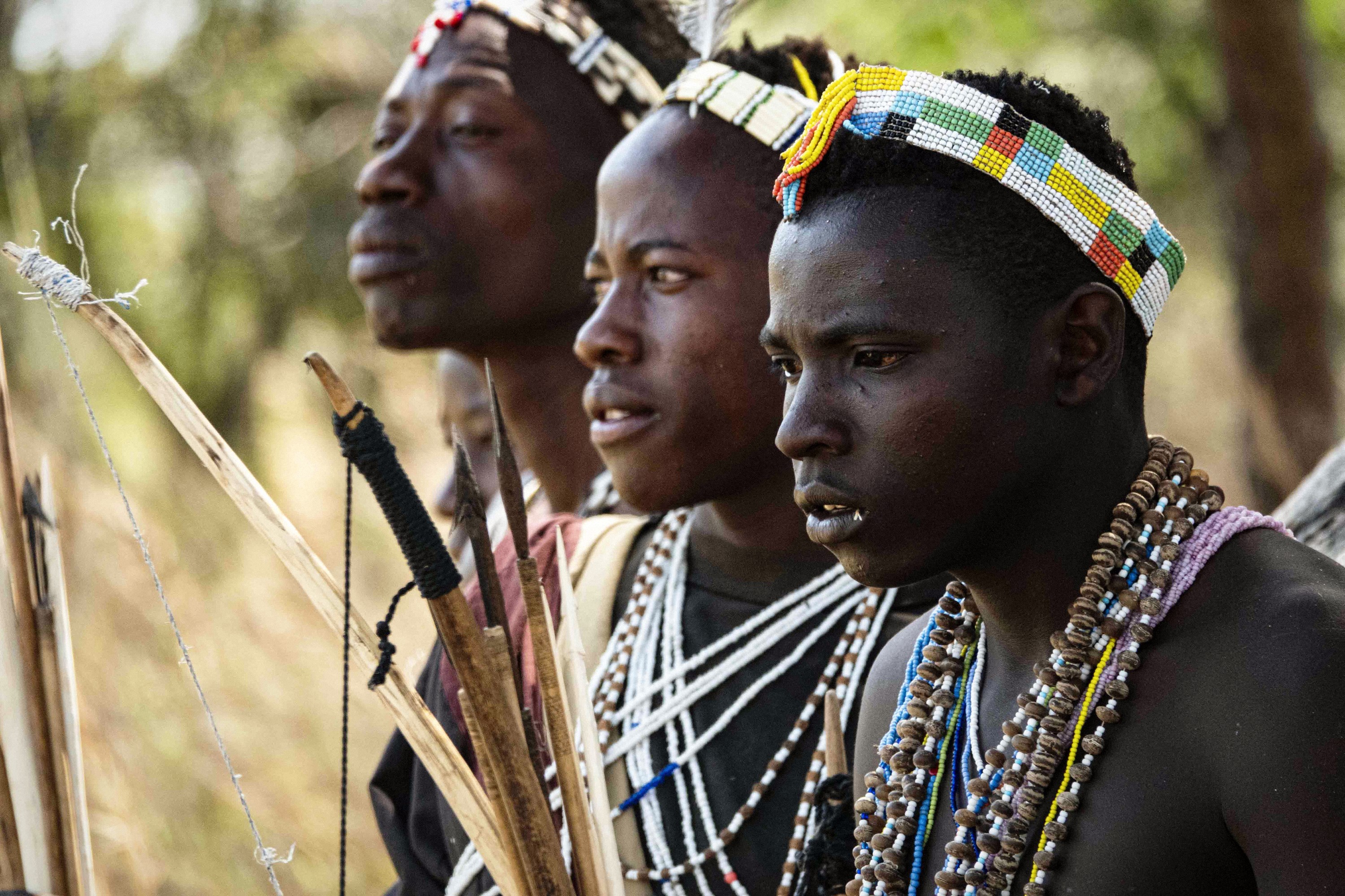 Hadza hunters posing with their bows